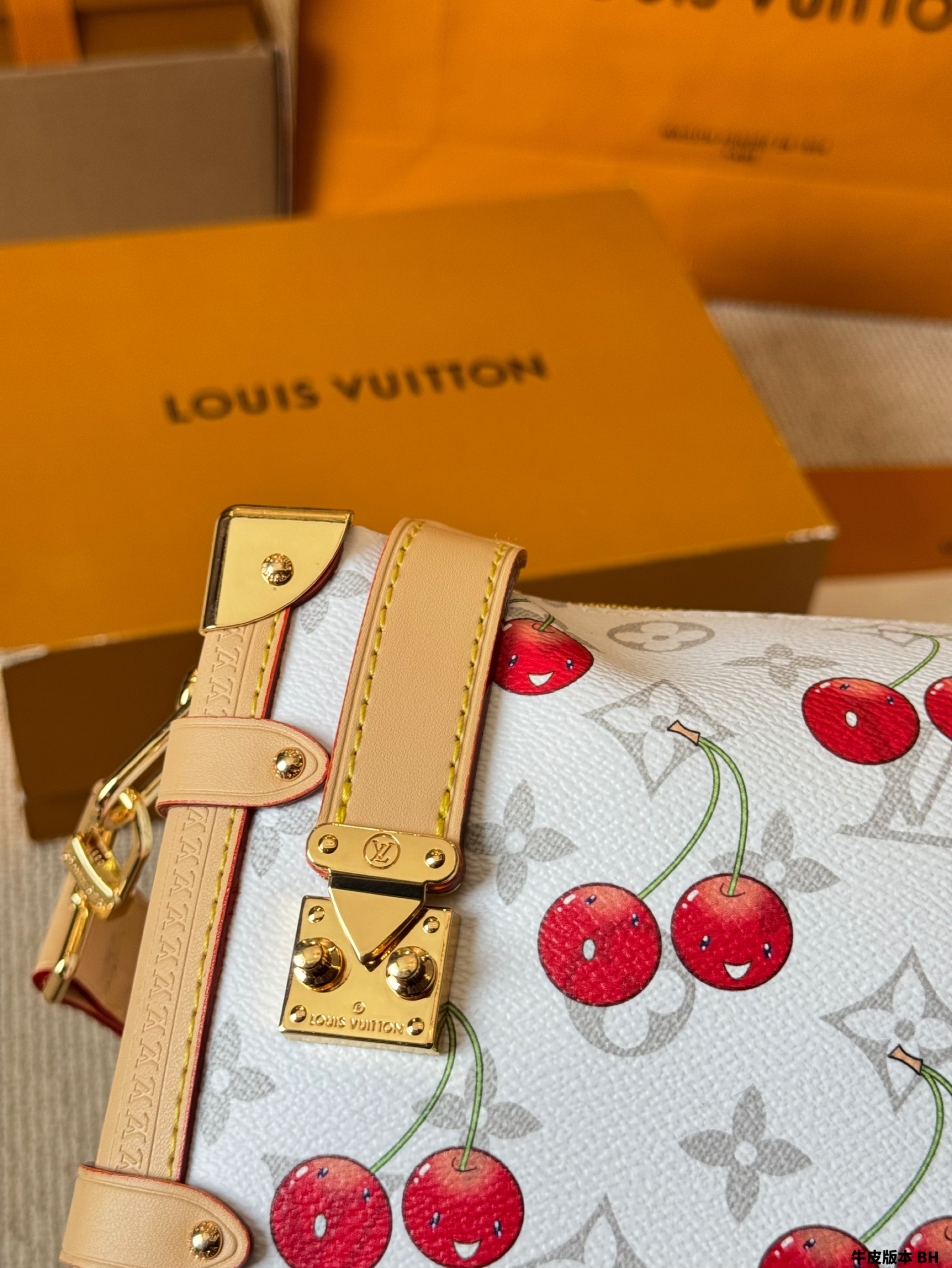 LV Side trunk cherry bag
