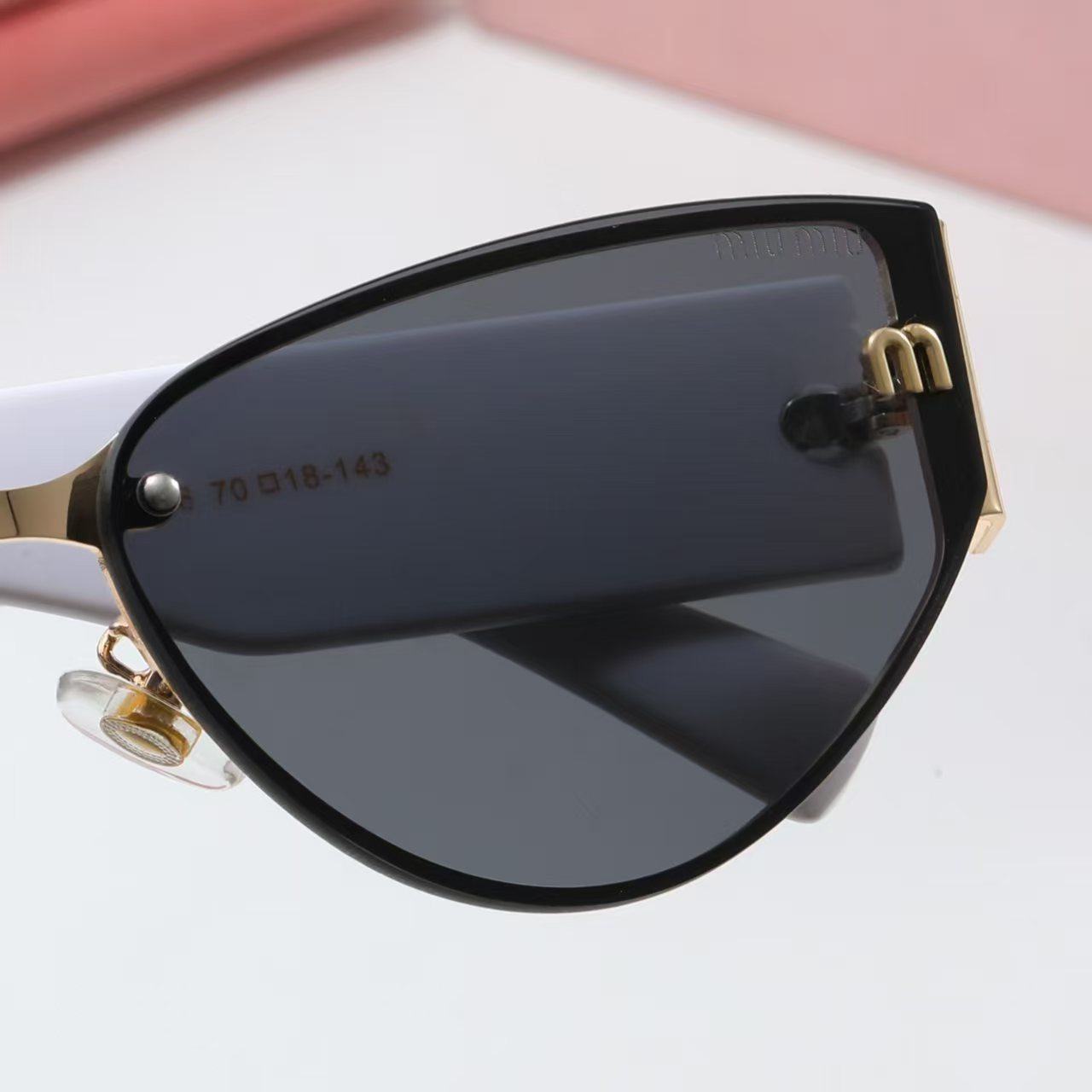 MIUMIU cat-eye playful sunglasses