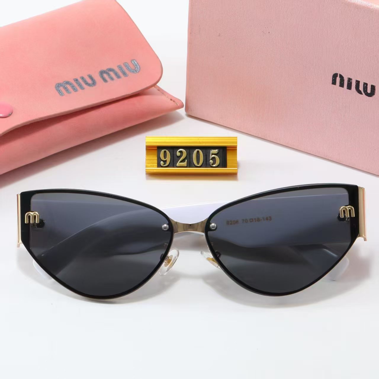 MIUMIU cat-eye playful sunglasses