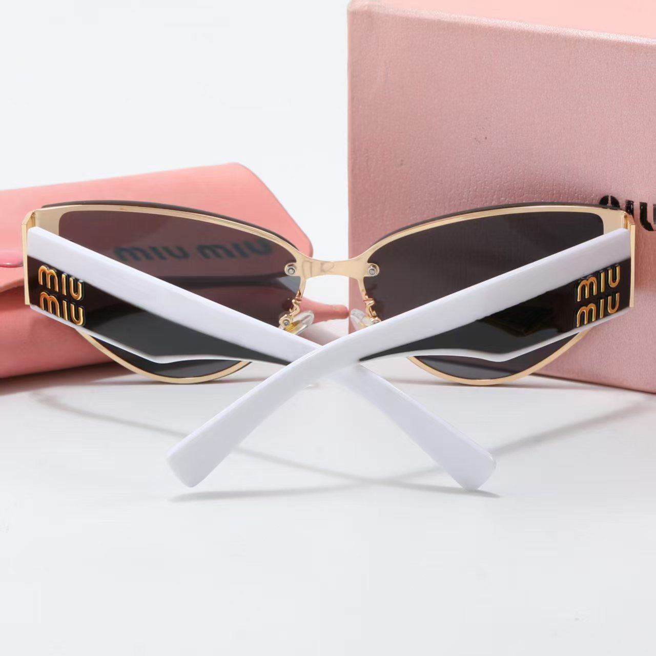 MIUMIU cat-eye playful sunglasses