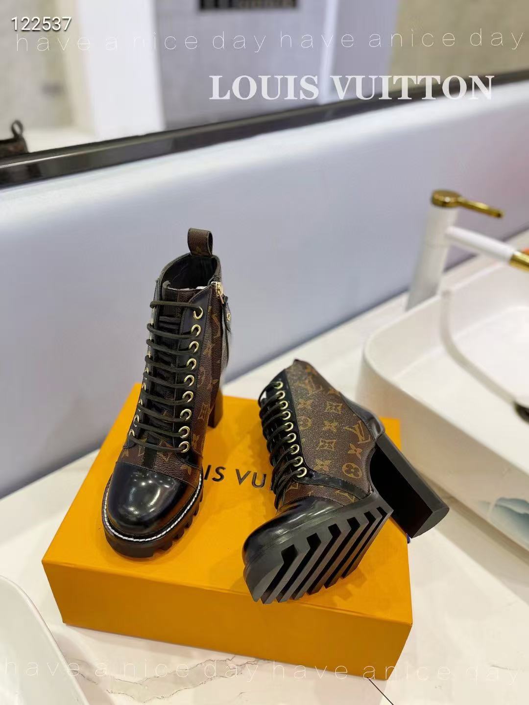 LV boots and high heels