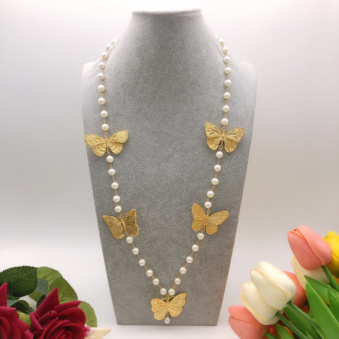 Chanel butterfly sweater chain