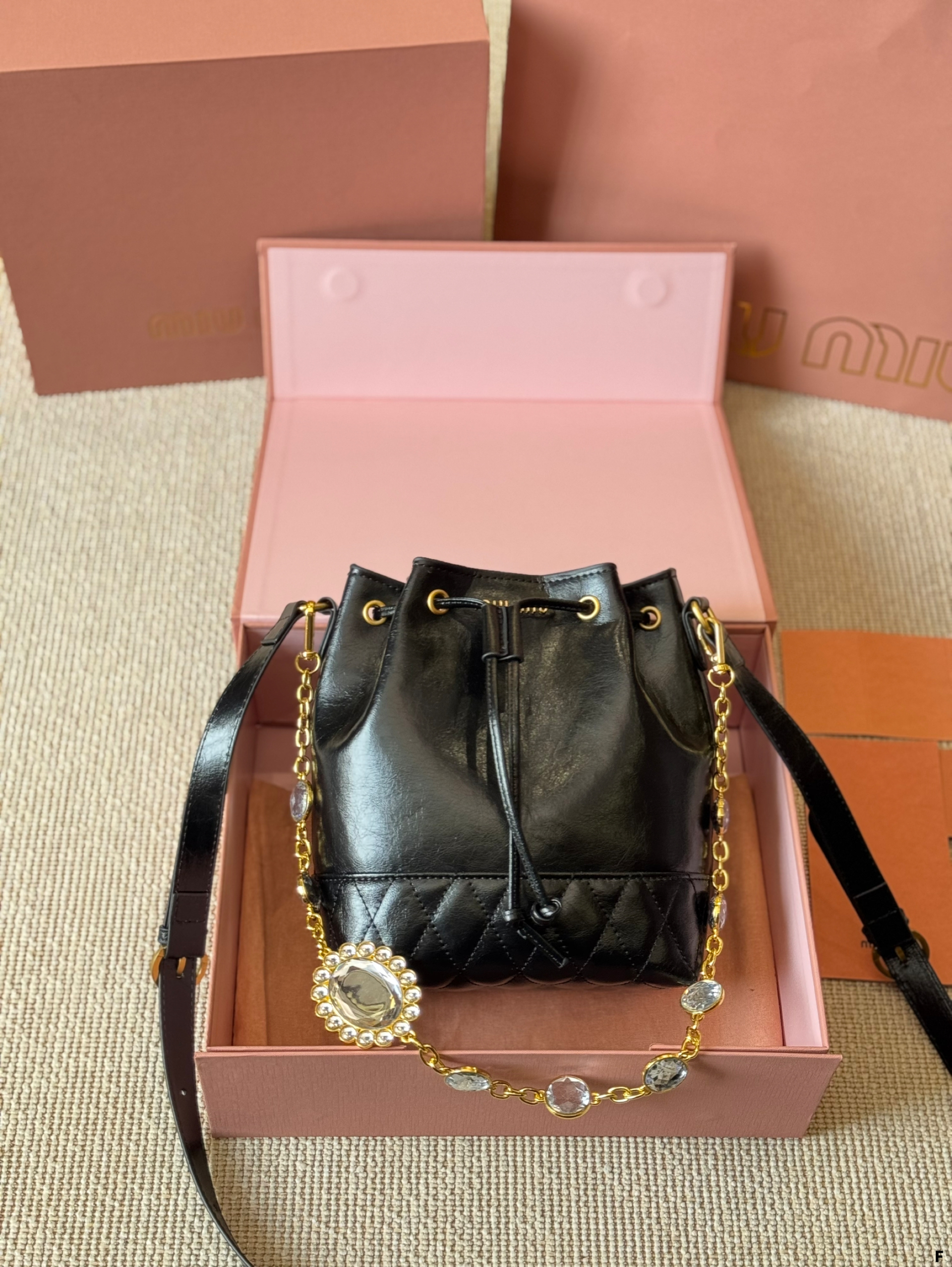 MIUMIU oil wax leather small bucket bag