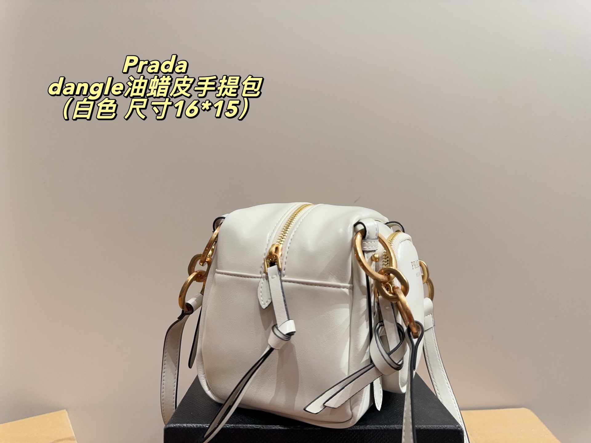 Prada dangle mini oil-wax leather handbag