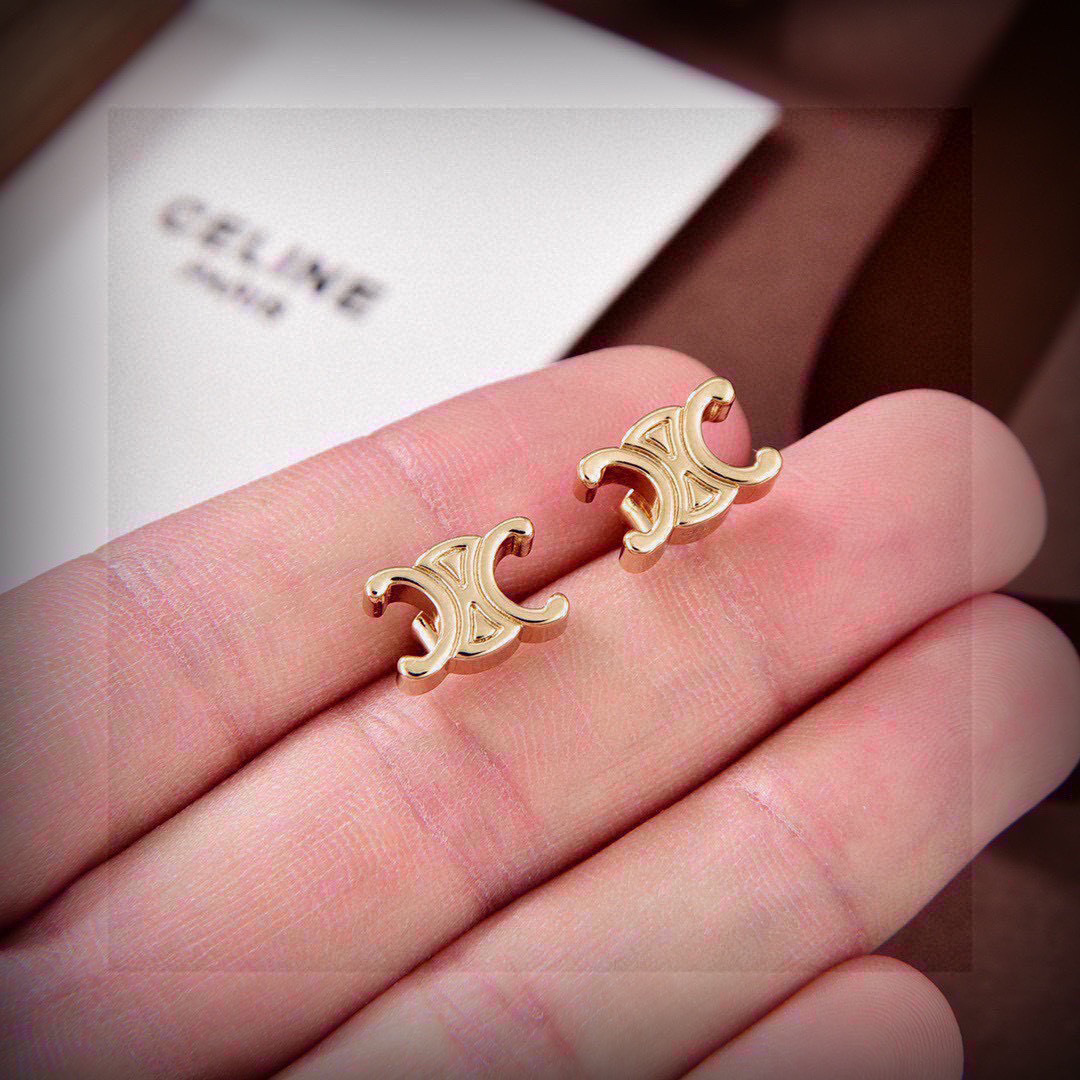 Celine's new golden arc de Triomphe stud earrings