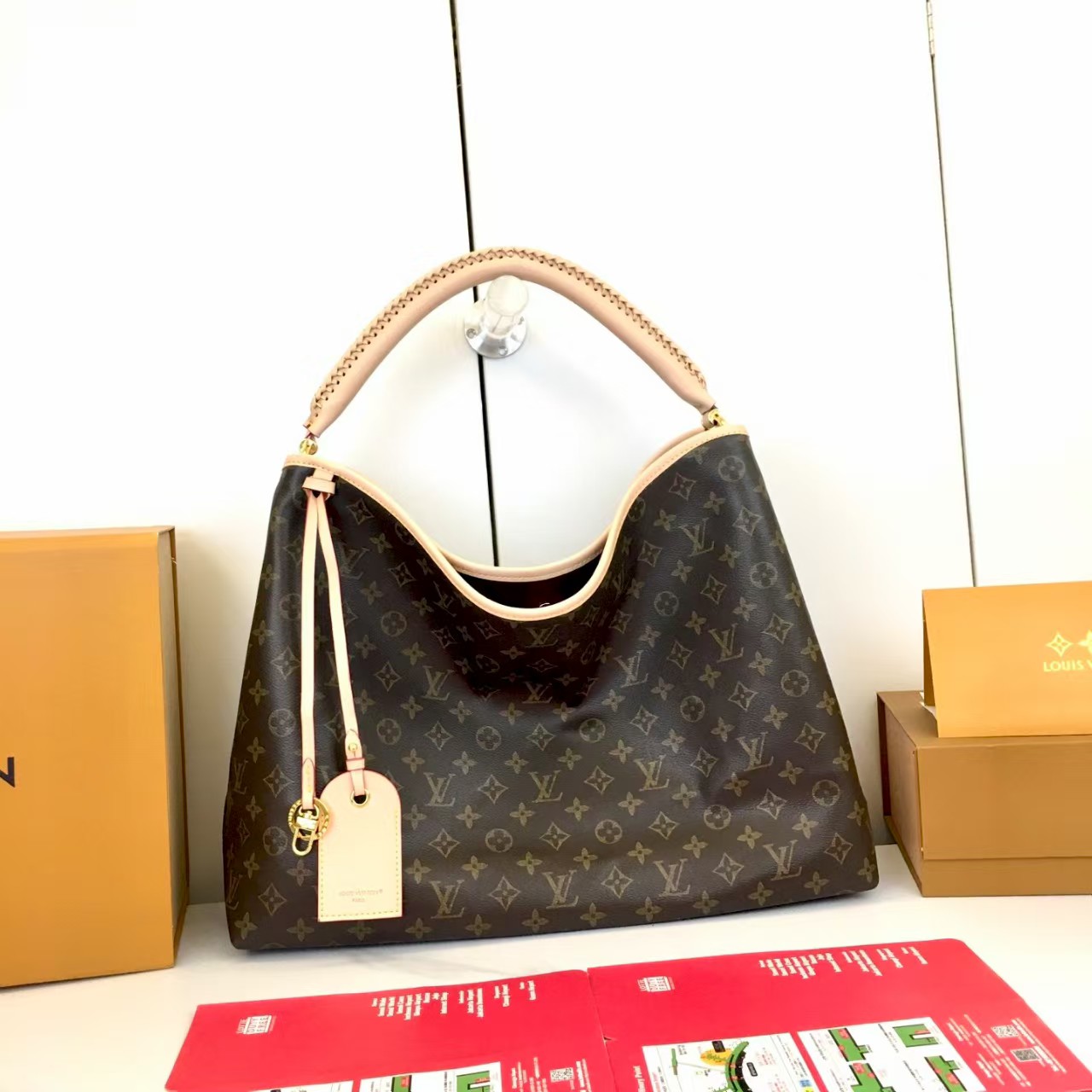 LV again artsy monogram handbag