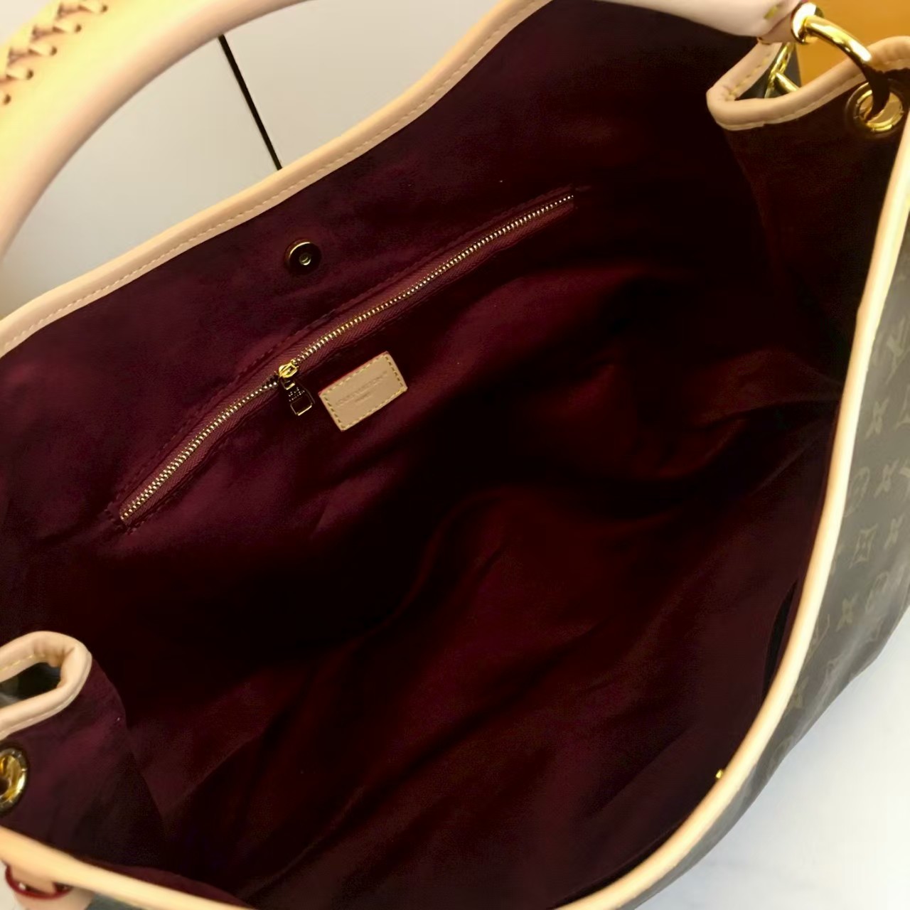 LV again artsy monogram handbag