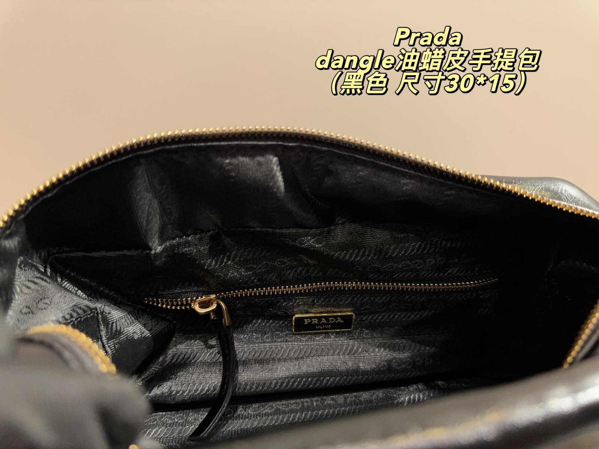 Prada dangle waxed leather handbag