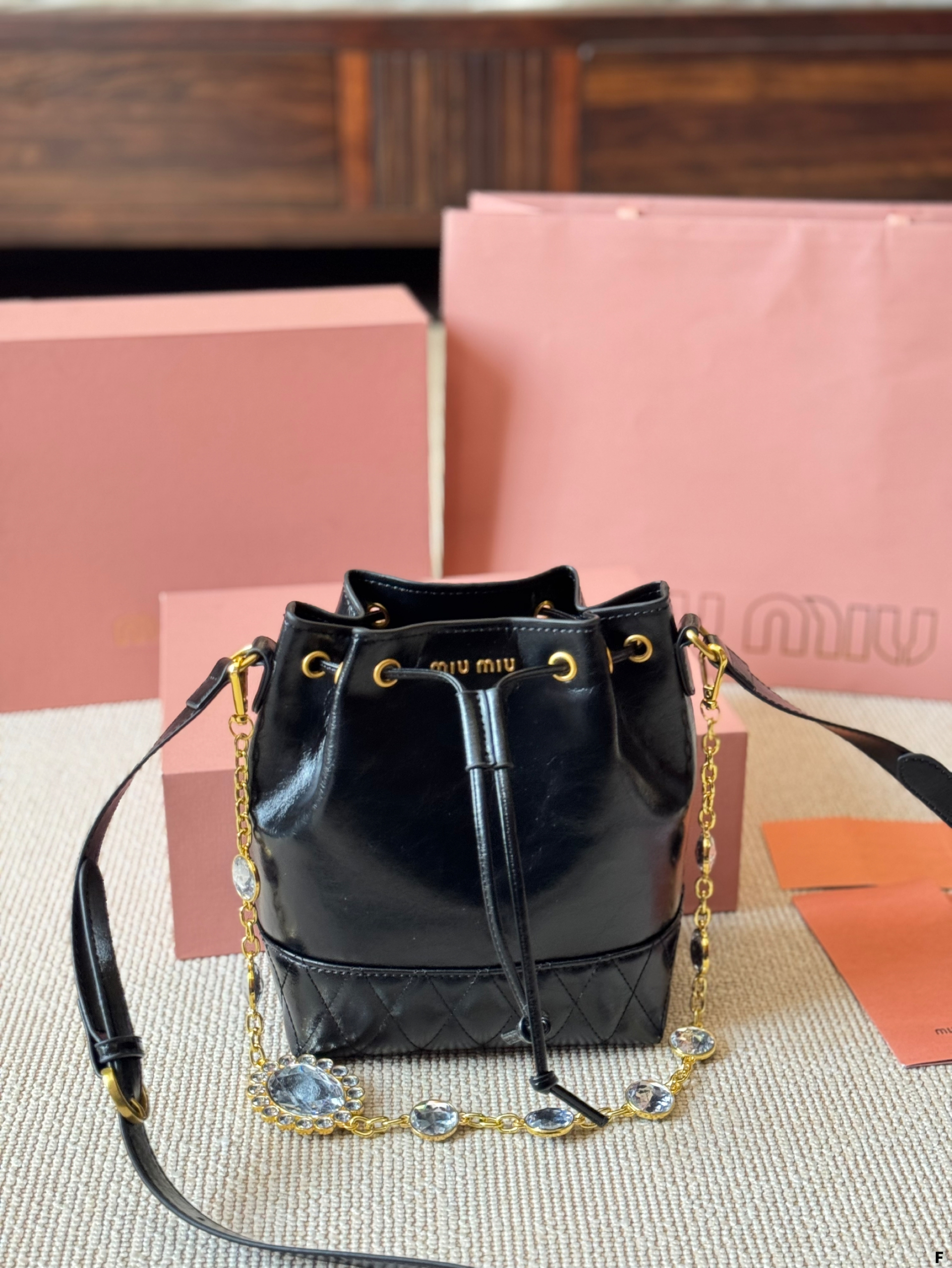 MIUMIU oil wax leather small bucket bag