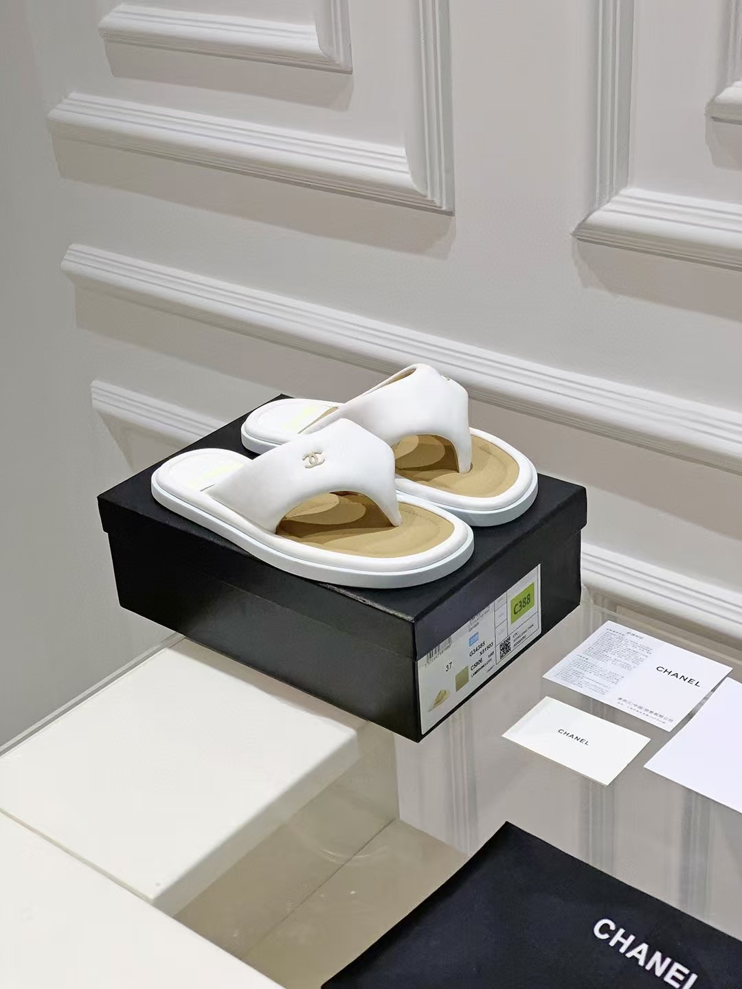 Chanel bread flip-flops