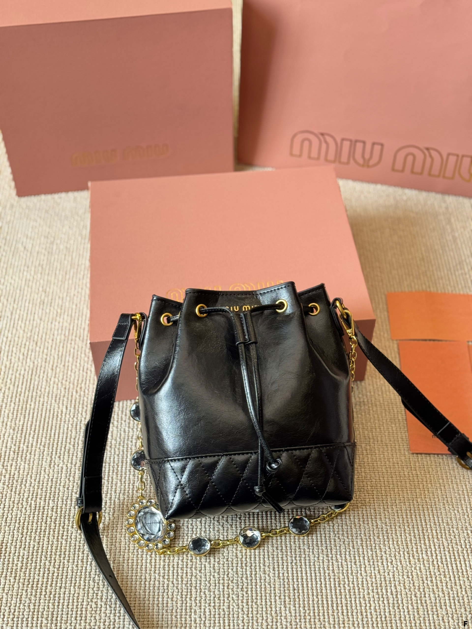 MIUMIU oil wax leather small bucket bag