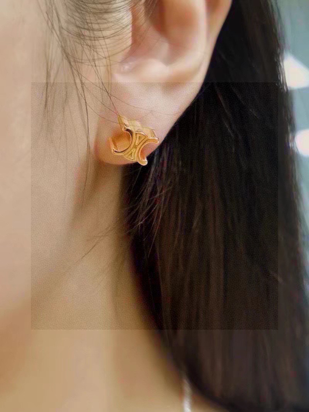 Celine's new golden arc de Triomphe stud earrings