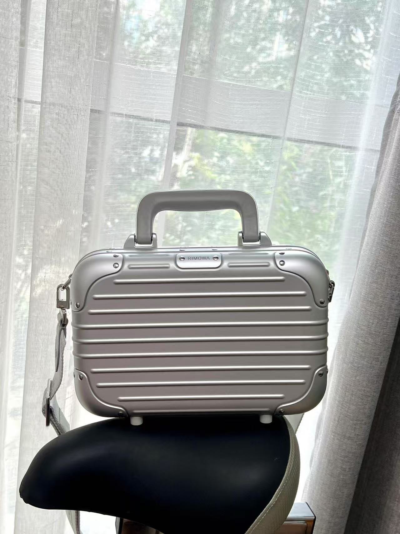 RIMOWA hand-held crossbody suitcase