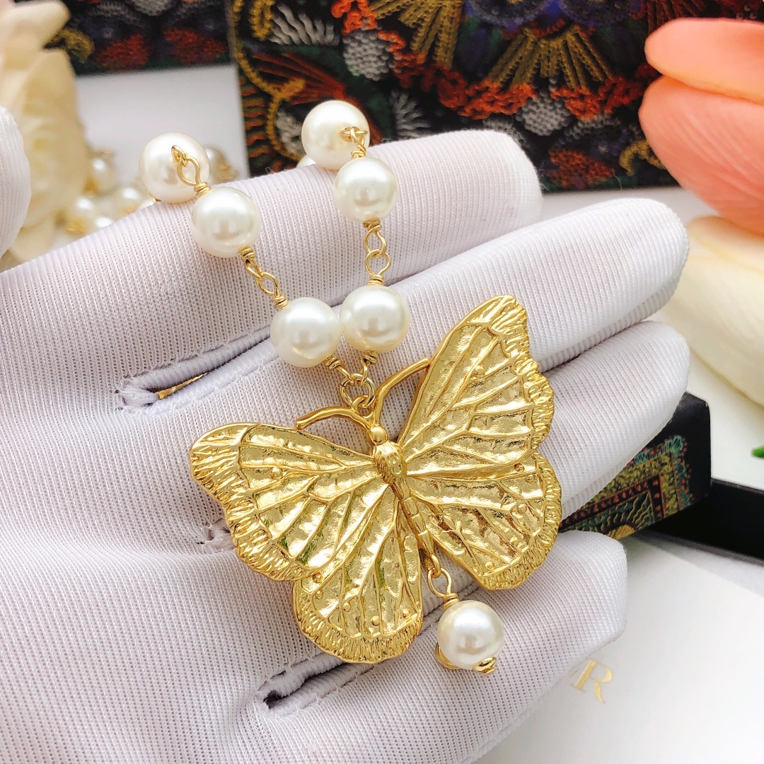 Chanel butterfly sweater chain