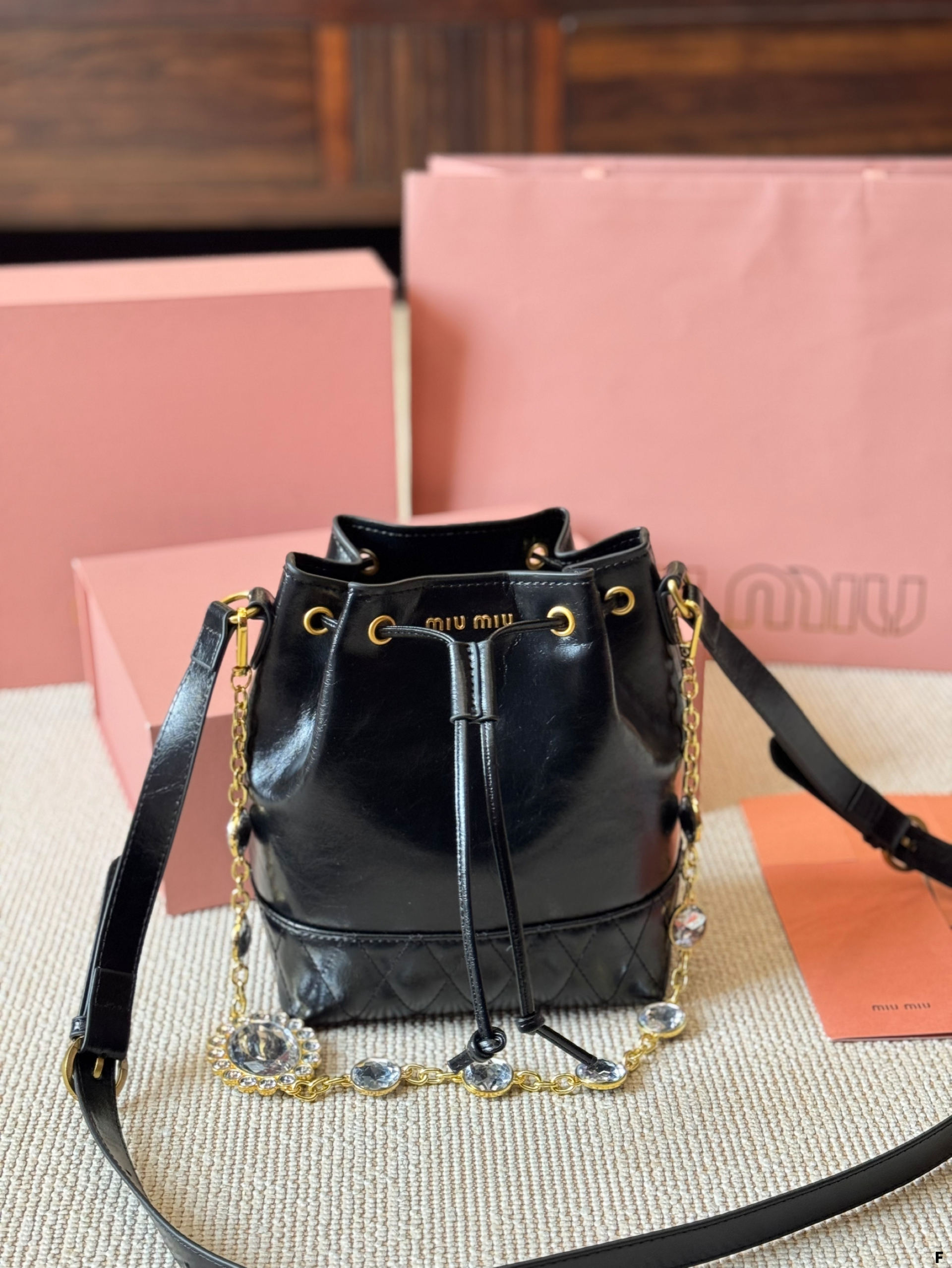 MIUMIU oil wax leather small bucket bag