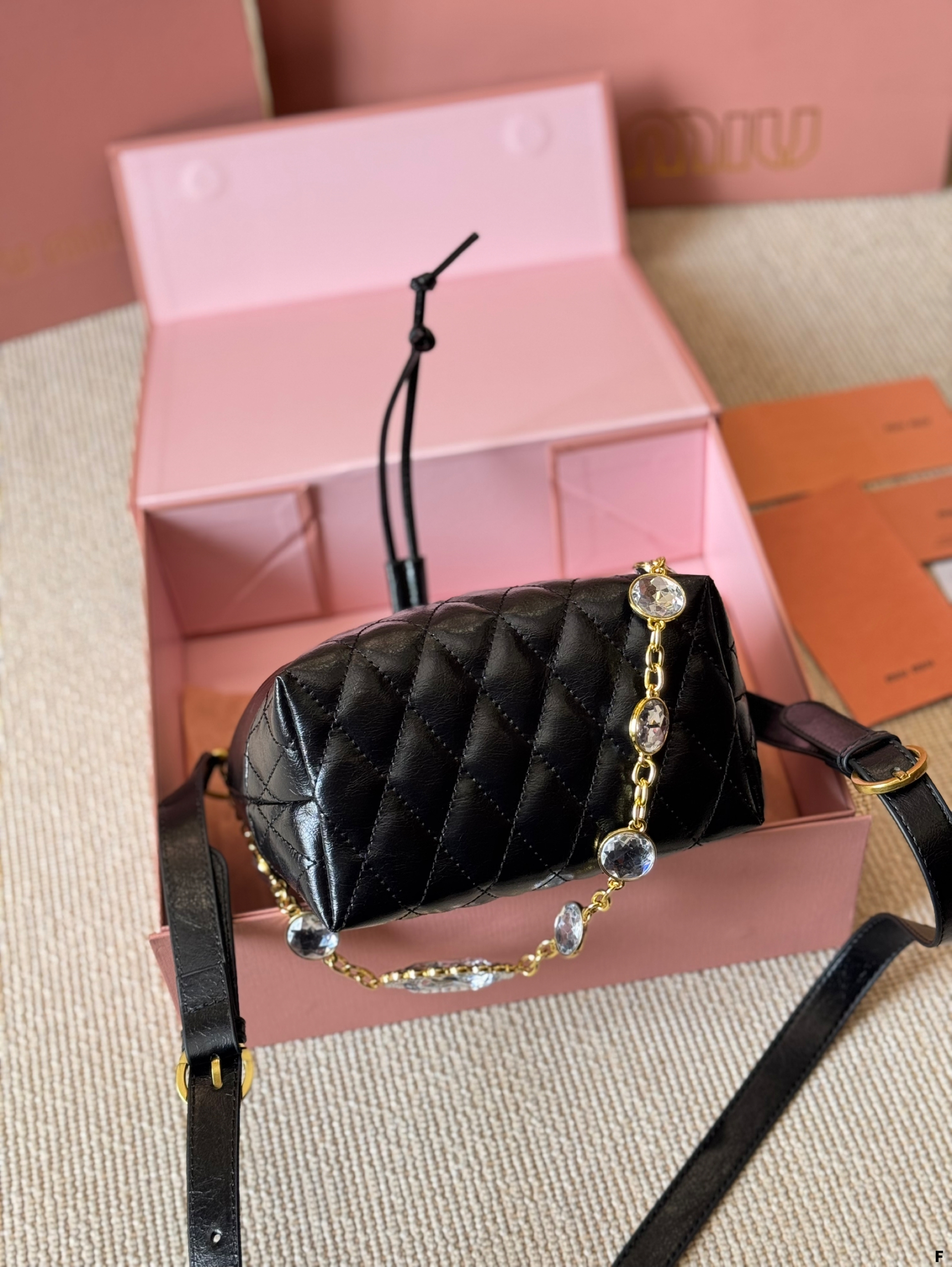 MIUMIU oil wax leather small bucket bag