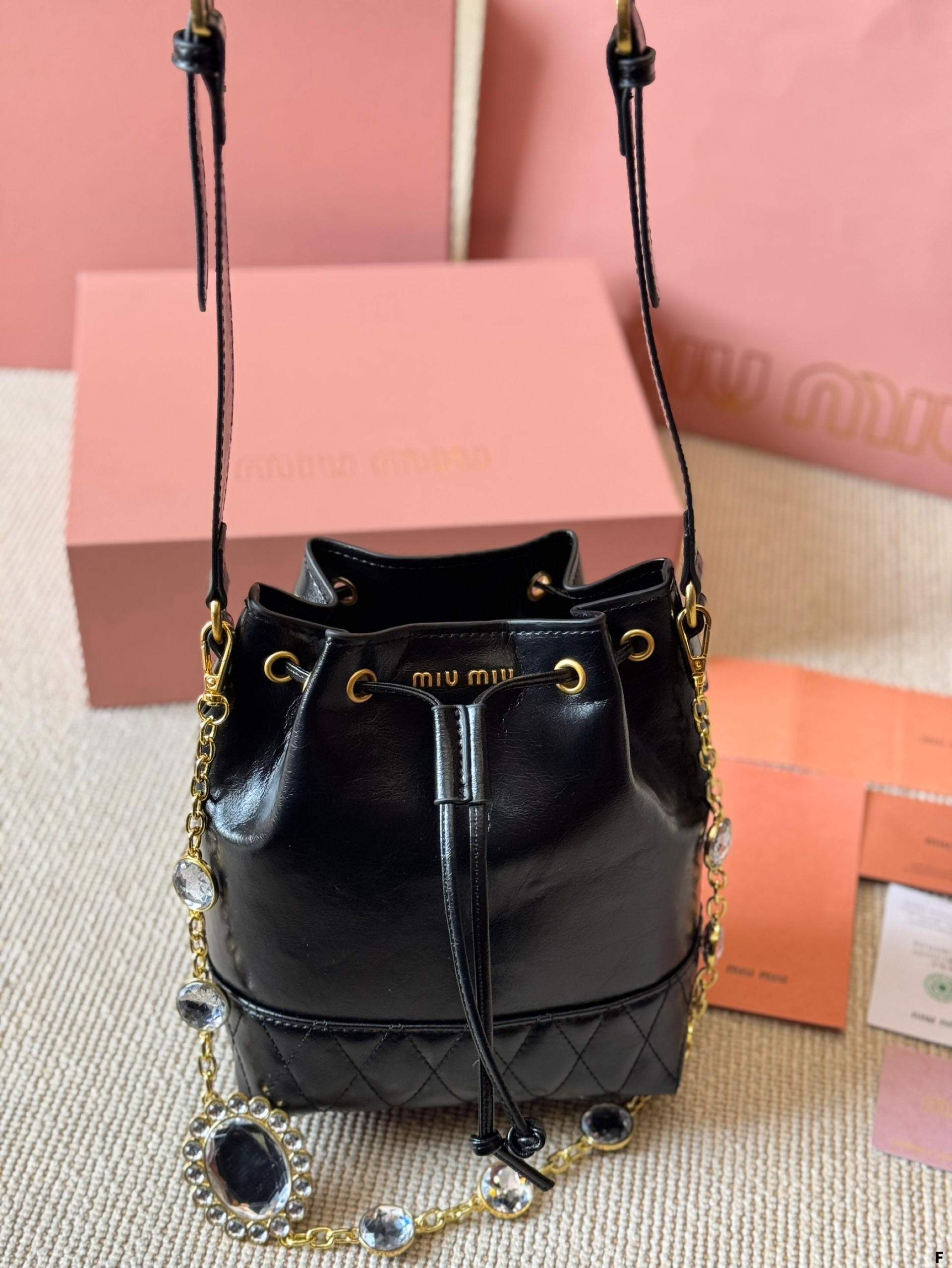 MIUMIU oil wax leather small bucket bag