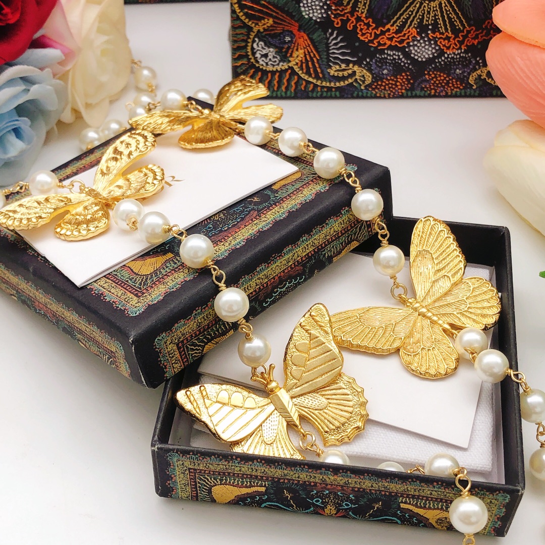 Chanel butterfly sweater chain