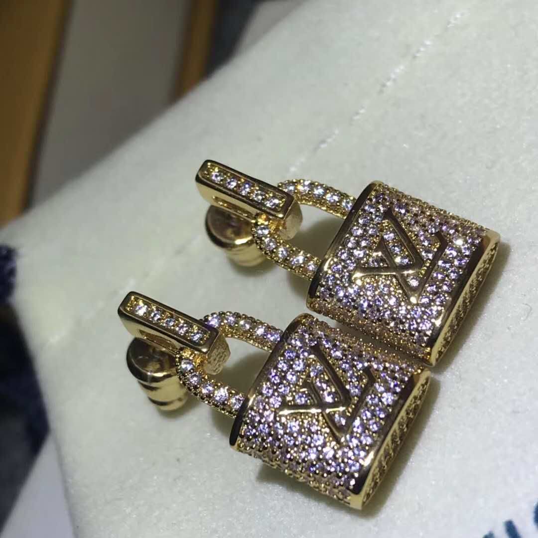 LV gold lock earrings