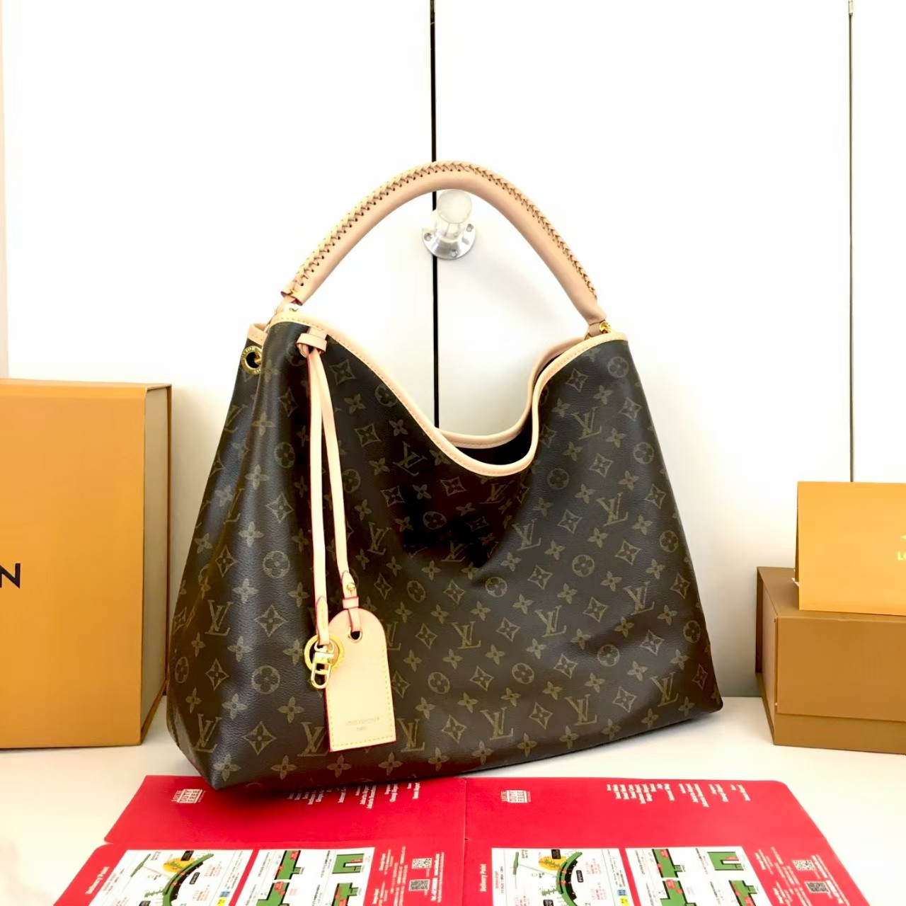 LV again artsy monogram handbag