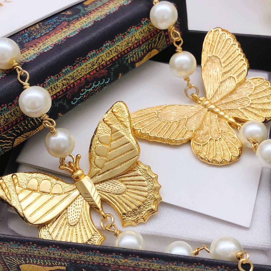 Chanel butterfly sweater chain