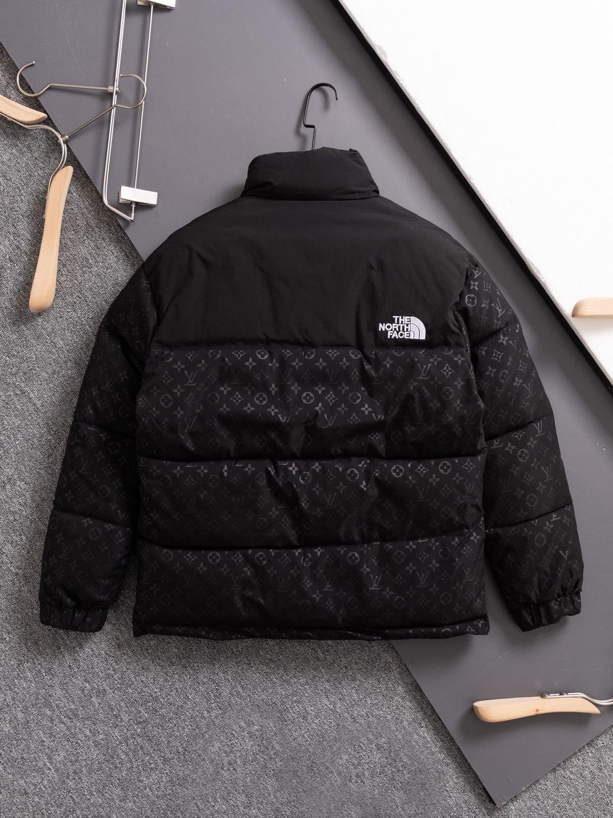 The North Face collaboration with Louis Vuitton (LV) in a cotton jacket.