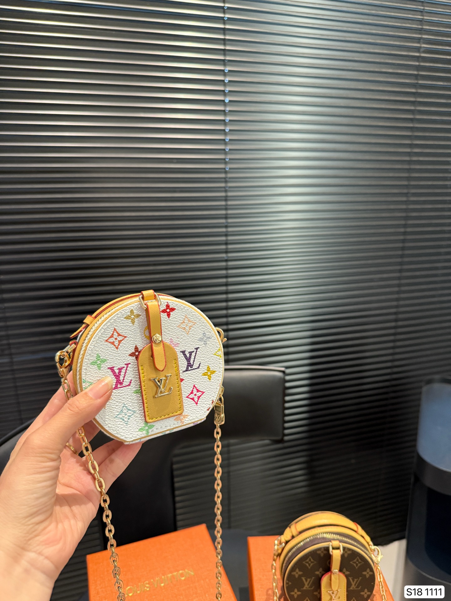 LV round pancake coin purse