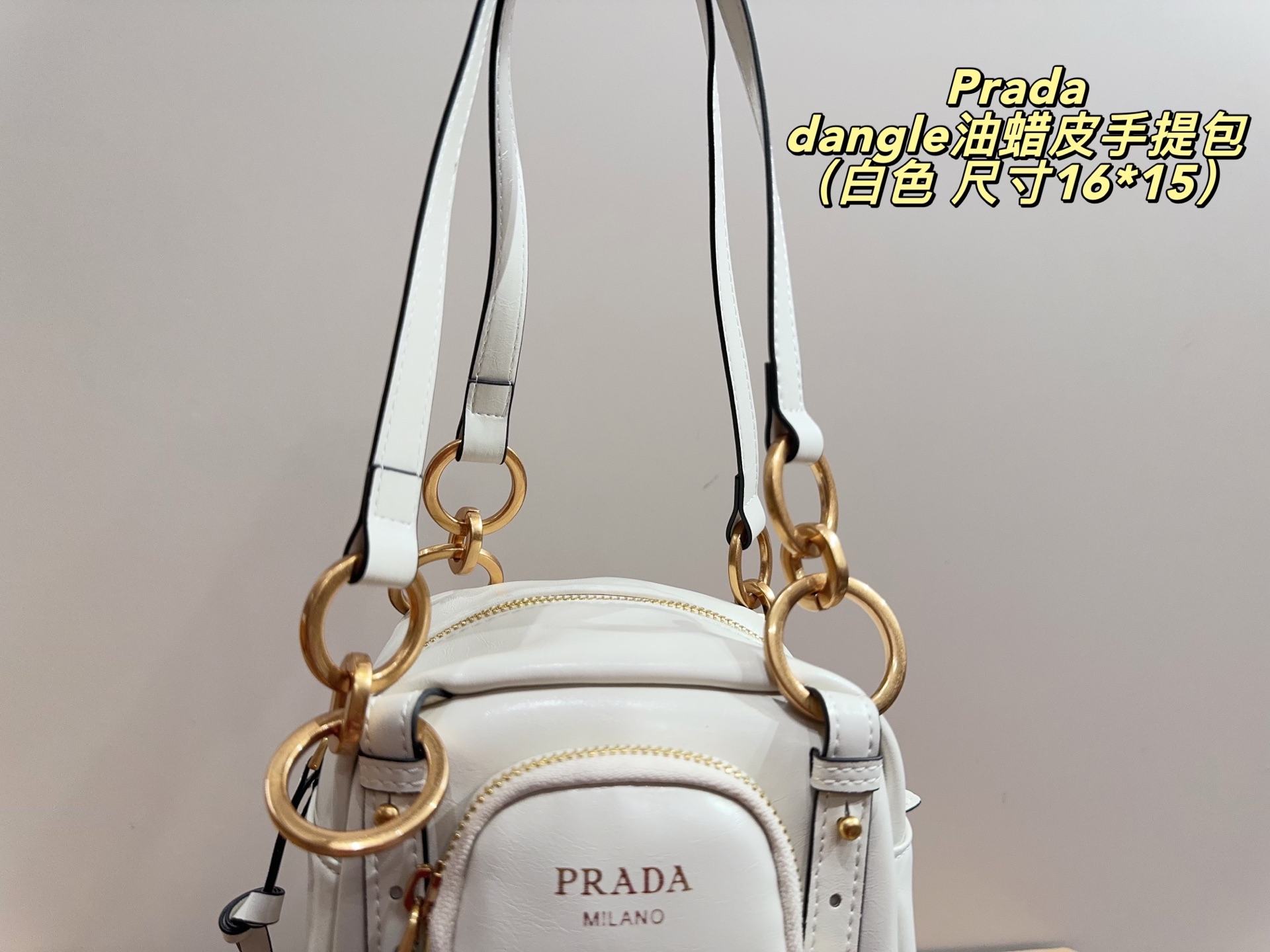 Prada dangle mini oil-wax leather handbag