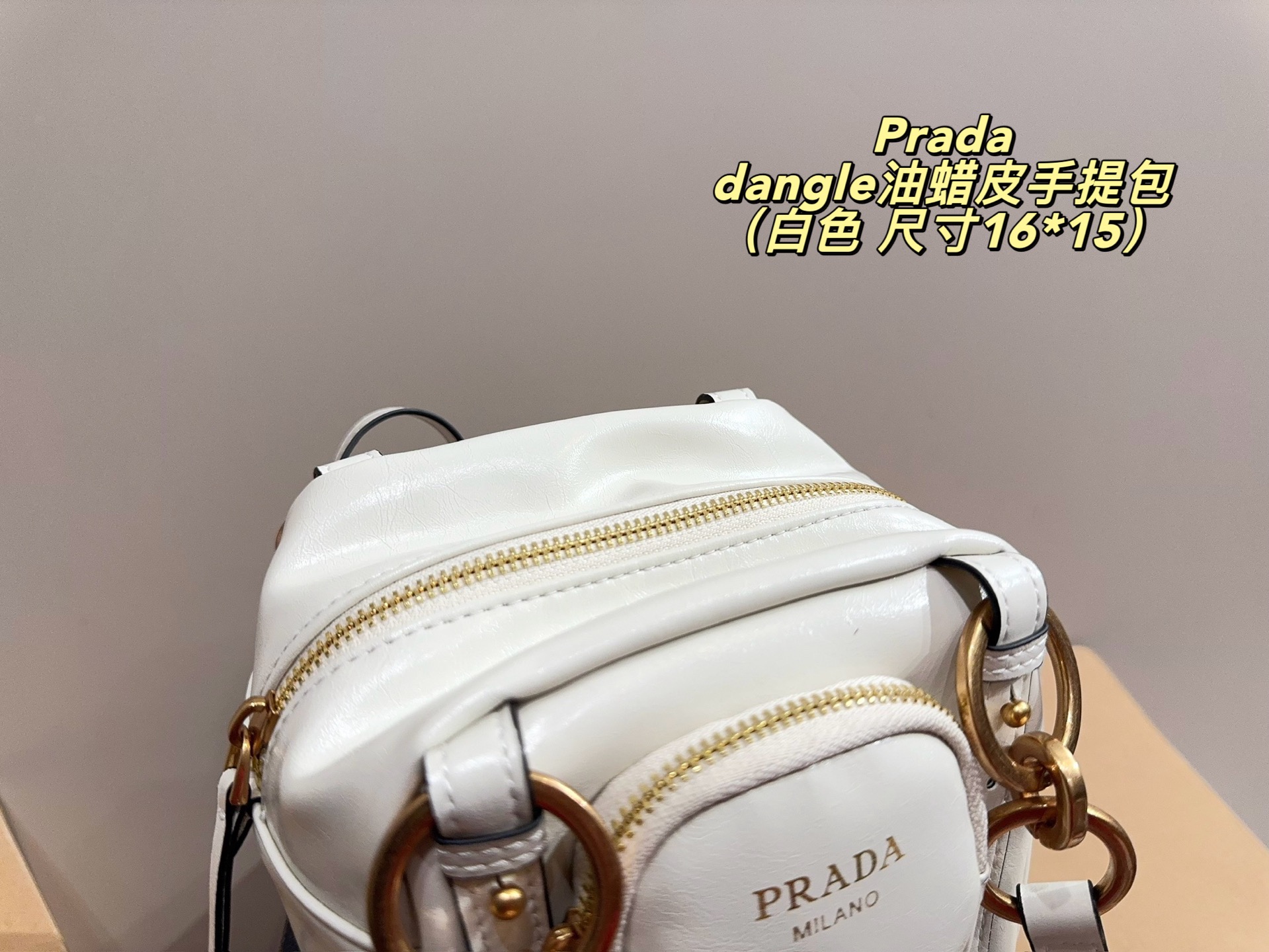 Prada dangle mini oil-wax leather handbag