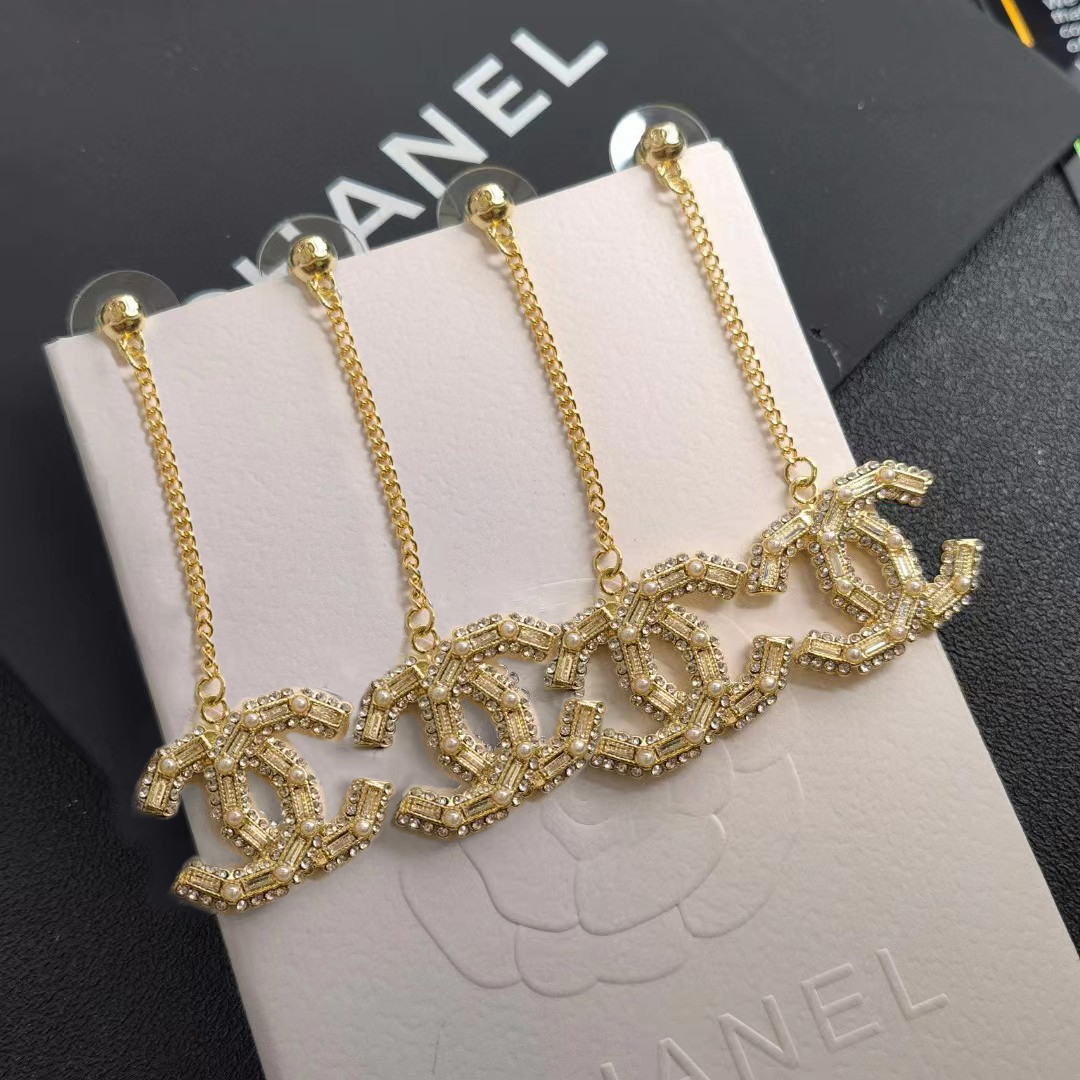 Chanel pearl tassel stud earrings