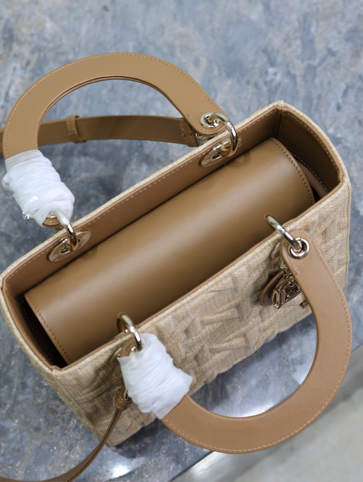 Five-compartment  handbag with “Raffia-patterned woven strips” design