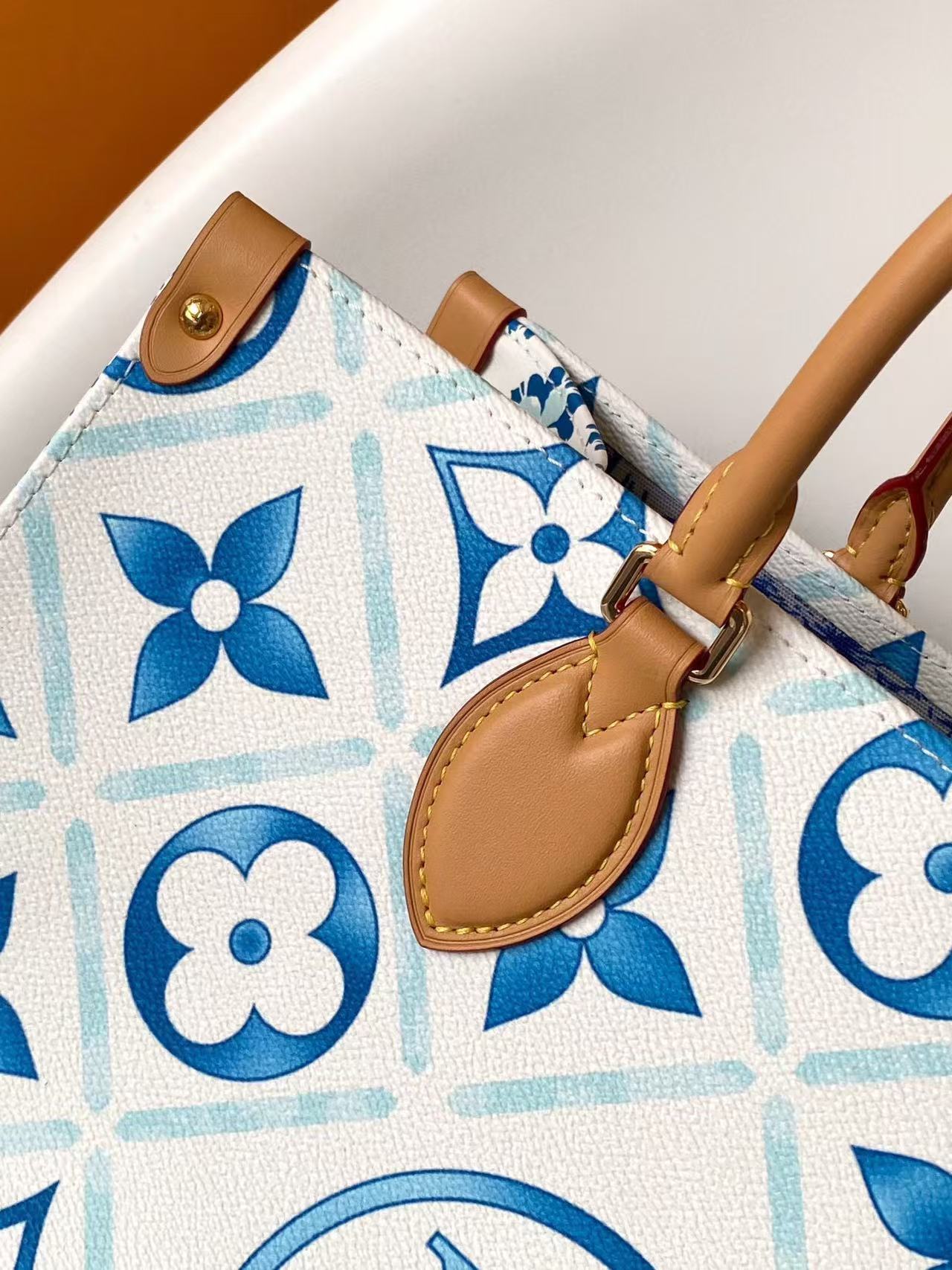 LOUIS VUITTON ONTHEGO MM MONOGRAM EMBLEM IN BLUE & BROWN