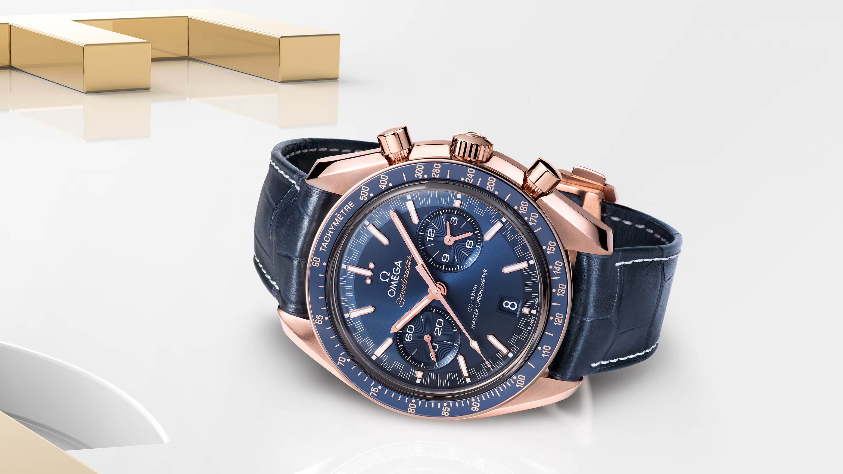 OMEGA SPEEDMASTER RACING 44.25 MM, SEDNA™ GOLD ON LEATHER STRAP
