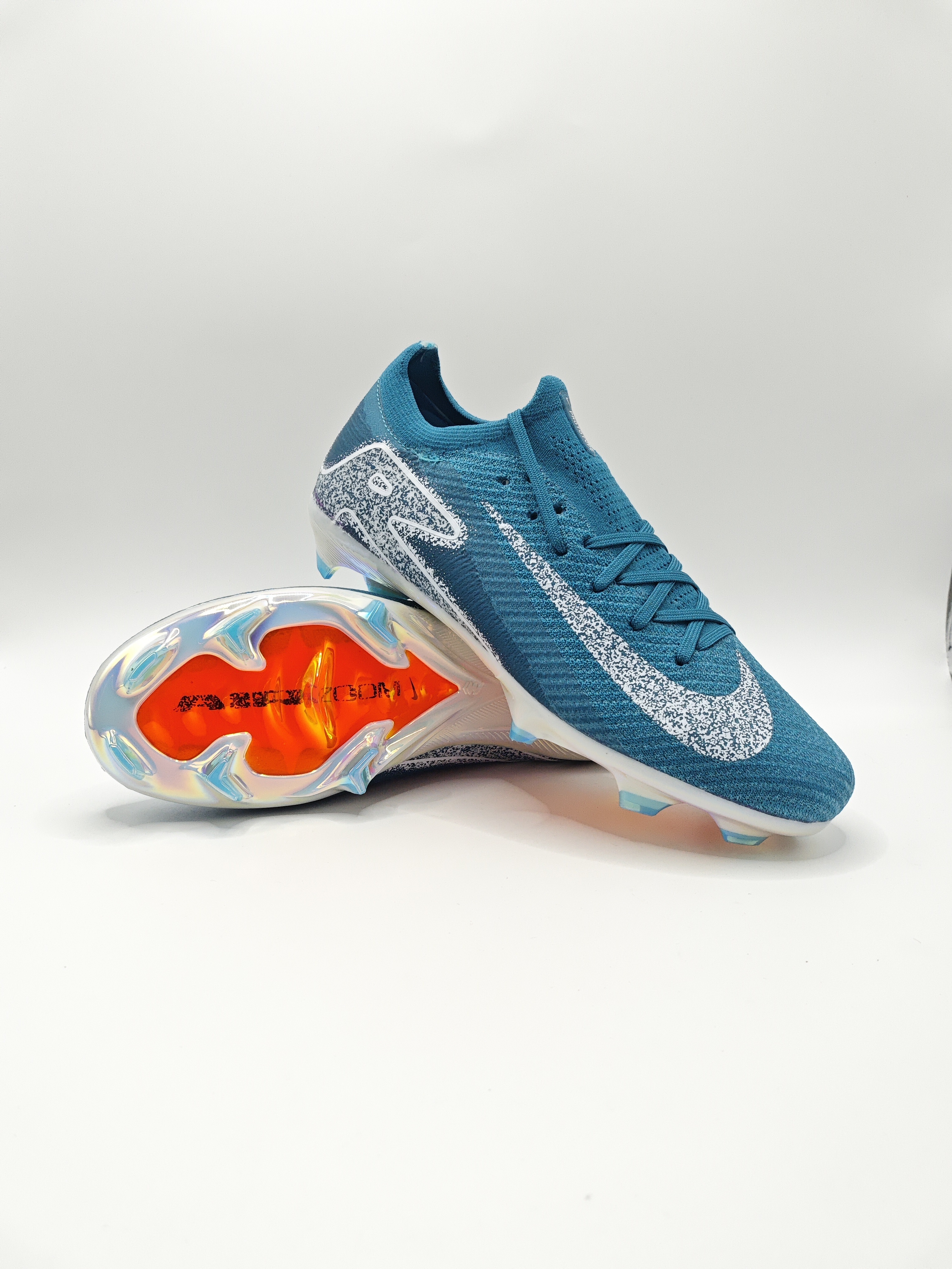 Nike Mercurial 16 FG Soccer Cleats with Built-in Bonded Pack: Full Air Cushion for All-Game Comfort, Waterproof Knit for Rainy Pitches